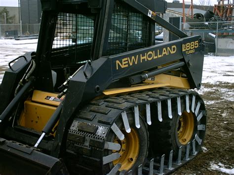 tracked skid steer pushing snow|track cleats for skid steer.